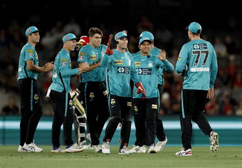 Xavier Bartlett and the Brisbane Heat celebrate Martin Guptill's wicket ...