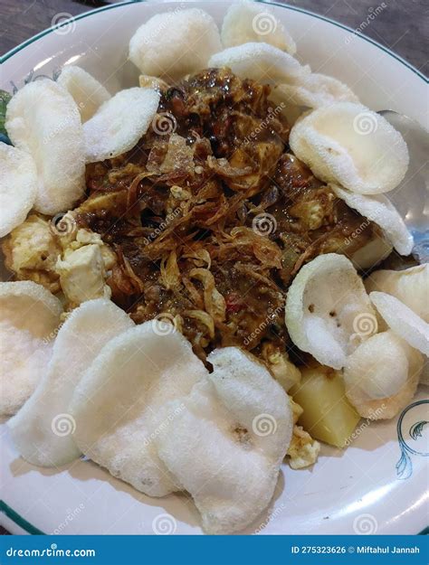 Tahu Tek Which Consists of Rice Cake, Fried Eggs and Boiled Potatoes Topped with Petis Peanut ...