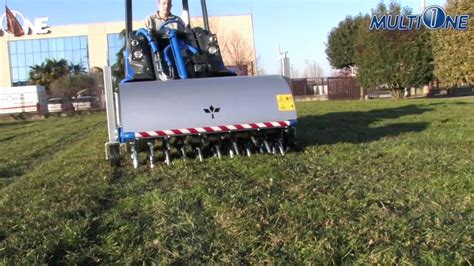 MultiOne Loader with Core Aerator Attachment - YouTube