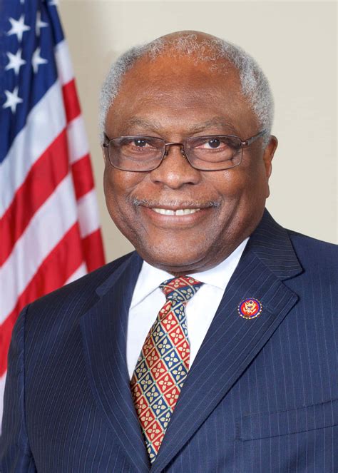 Download Jim Clyburn Smiling With American Flag Wallpaper | Wallpapers.com