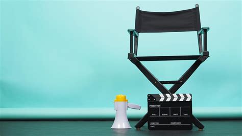 Premium Photo | BLACK director chair with megaphone and Clapperboard on mint or Tiffany Blue ...