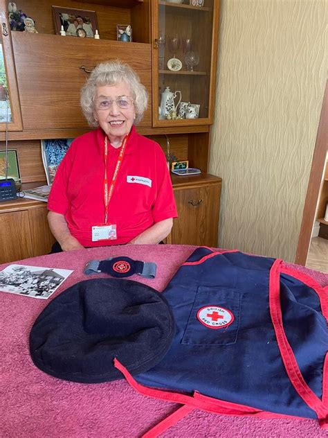 Patricia, British Red Cross volunteer, with her British Red Cross ...