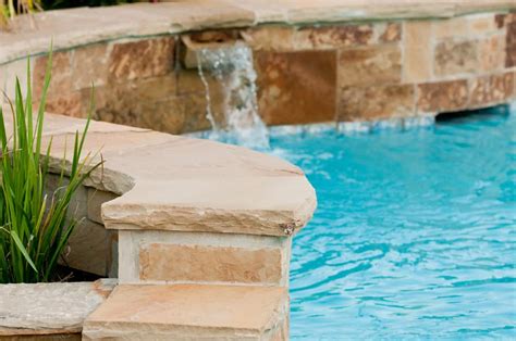 13 Beautiful Pool Waterfalls for Your Backyard Oasis - Love Home Designs