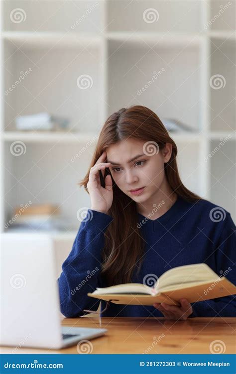 Sad Teenager Studying Preparing for Exam Test in the University Library. Depressed Young Woman ...