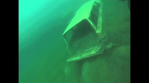 sunken vehicles at rock quarry - YouTube