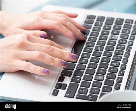 Young woman typing on laptop keyboard, focus on hands Stock Photo - Alamy