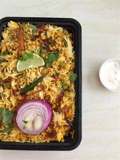 Vegetable biryani with raita, onion, and lime | Food, Food out, Biryani