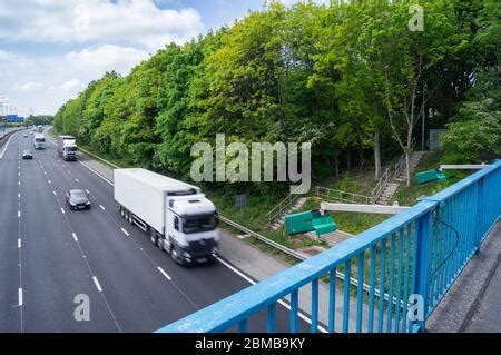 ANPR Cameras on motorway bridge pointing at traffic highways agency cameras green housing ...