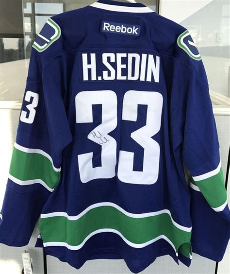 Henrik Sedin Autographed Vancouver Canucks Jersey - NHL Auctions