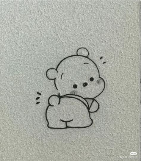 a drawing of a teddy bear holding a pillow