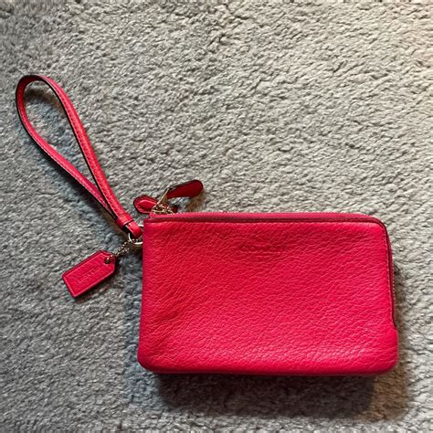 coach - wristlet wallet looks red but it’s more of... - Depop