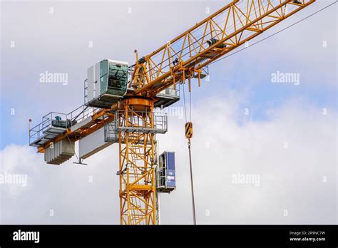 Building under construction. Crane machinery structure. Industry. Vertical Stock Photo - Alamy