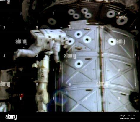 In this image from NASA Television, ISS flight engineer Sunita Williams ...