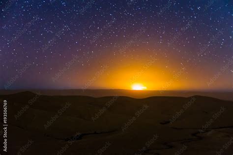 Night sky stars over desert hills sunset light. Stock Photo | Adobe Stock