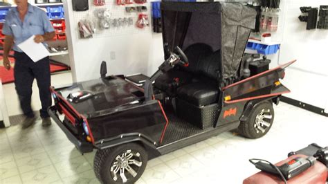 Yep...it's a bat mobile golf cart. However it looks a little like the Munsters Koach. The top ...