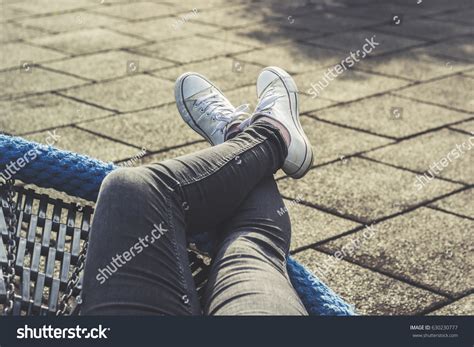 923 Girl Sitting Legs Crossed Wearing Jeans Images, Stock Photos & Vectors | Shutterstock