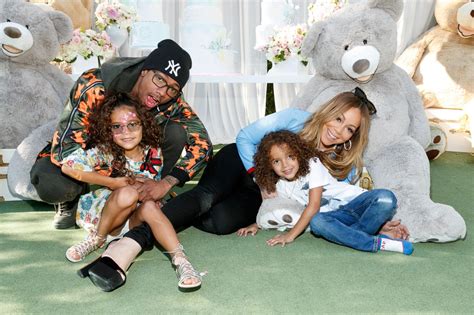 Mariah Carey's twins are all smiles posing next to dad Nick Cannon for sweet celebratory moment ...