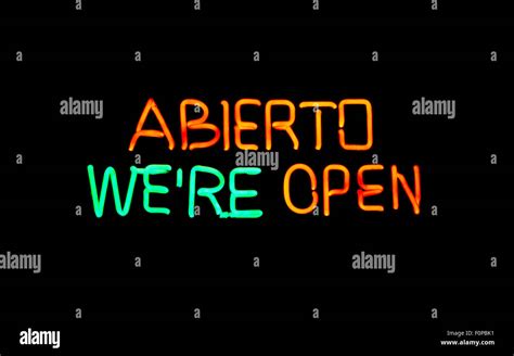 English-Spanish open neon sign Stock Photo - Alamy