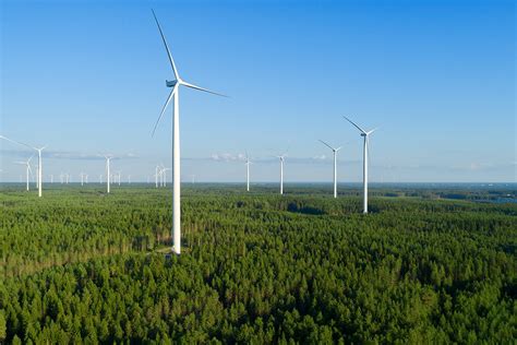 wind-farm-green-field-view-distant-forest-summer-evening | WindEurope