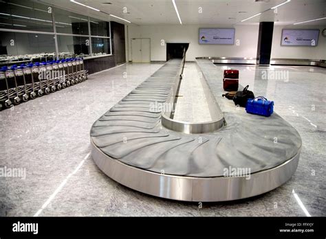 Baggage conveyor belt system area airport trolley passengers luggage ...