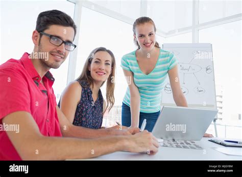 Portrait of young casual people in the meeting room Stock Photo - Alamy