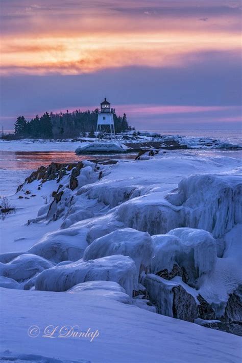 Grand Marais #Sunrise: Harbour #Lighthouse with #Winter #Ice - Larry and Linda Dunlap http://www ...