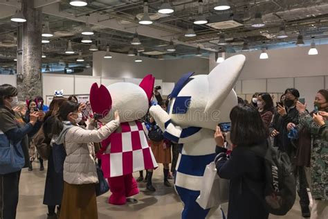 Japanese Women Taking Photos of Japanese Olympics and Paralympics Mascots Miraitowa and Someity ...