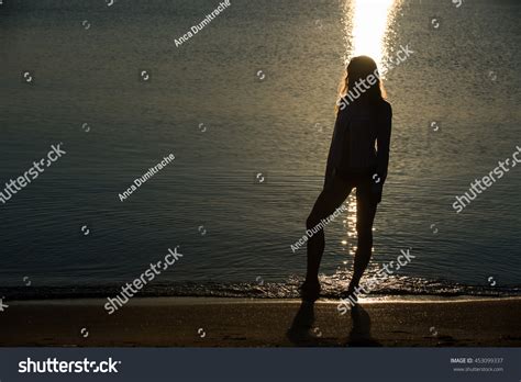 Woman Silhouette On Beach Sunrise Stock Photo 453099337 | Shutterstock