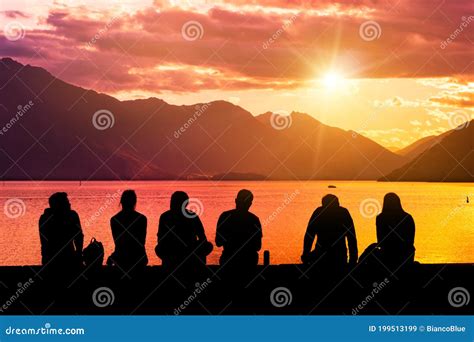 Silhouette Group of Young People Sitting on Beach Stock Image - Image ...