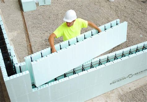 ICF forms being set by a construction worker | Insulated concrete forms, Passive house, Concrete ...