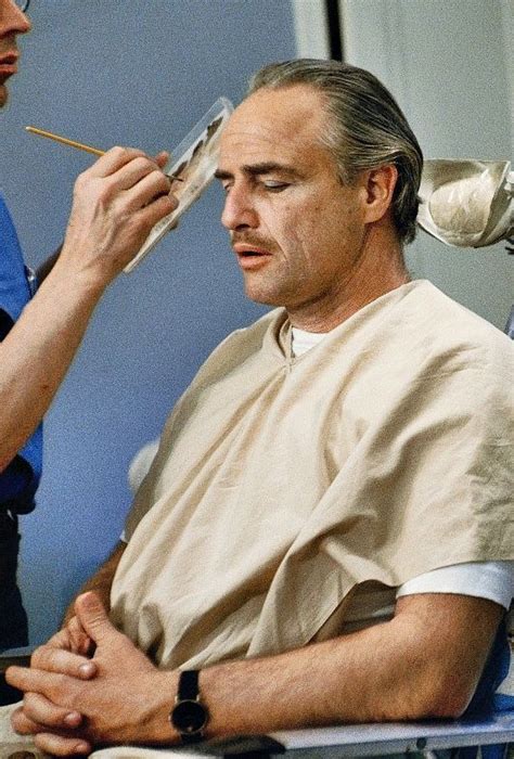 Marlon Brando in the makeup chair while preparing for his role as Don ...