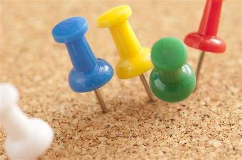 Free Image of Close up Colored Pins on Cork Board | Freebie.Photography