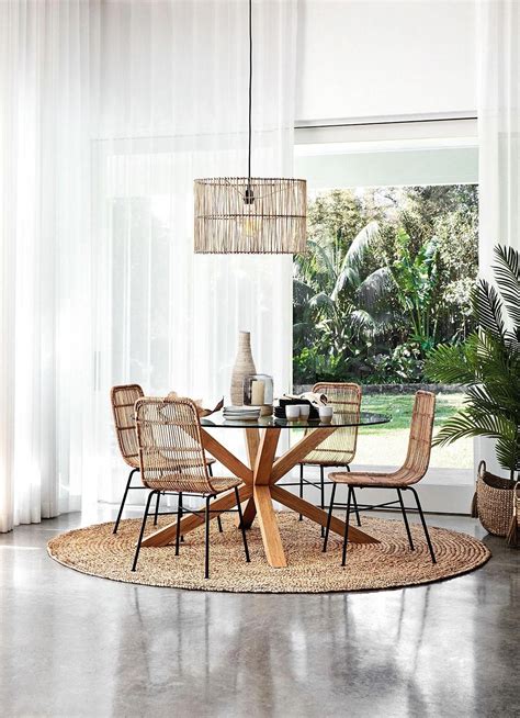 round jute rug under glass dining table from freedom with coastal ...