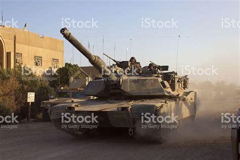 "M1 Abrams Main Battle Tank crew prepares for combat patrol in ...