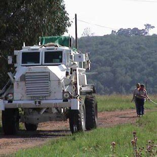 A sampling team working behind a Casspir mine protected vehicle. The... | Download Scientific ...