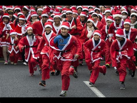 Tokyo, Japan Joyful participants wearing Santa Claus costumes take part in the Tokyo Great Santa ...