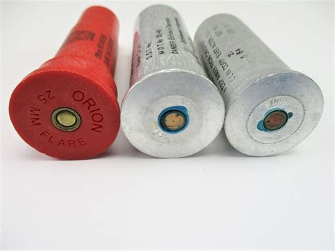 ASSORTED 25MM RED SIGNAL FLARES - Switzer's Auction & Appraisal Service