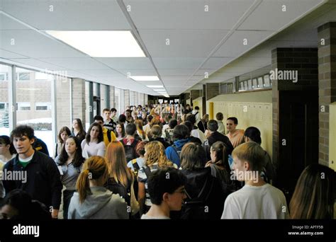 Crowds of high school students fill hallways during the exchanging of ...