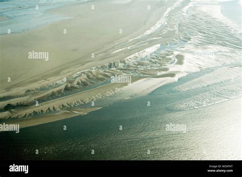 Aerial view from the Schleswig-Holstein Wadden Sea National Park in ...