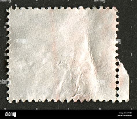 The reverse side of a postage stamp Stock Photo - Alamy