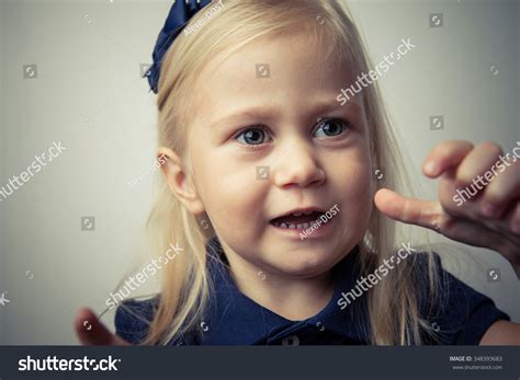 Adorable Little Girl Making Angry Face Stock Photo (Edit Now) 348393683