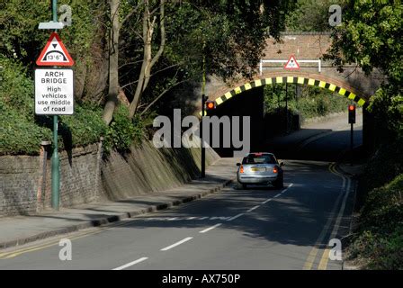 UK bridge clearance height warning sign. Low bridge concept, red triangle warning signs, UK road ...