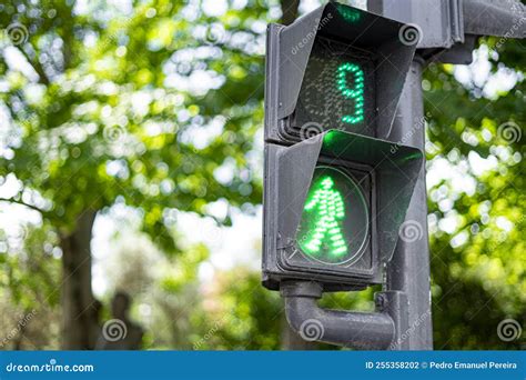 Green Traffic Light To Control Pedestrian Crossing with a Countdown To 9 Second. Stock Photo ...