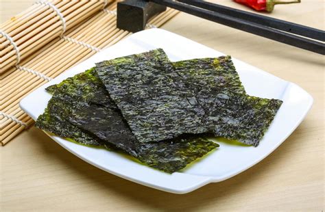 Nori sheets on the plate and wooden background 12276530 Stock Photo at ...