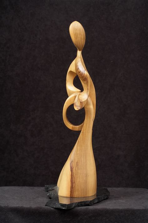 Wood sculptures. Desire to express in art. The Experience of Touch.