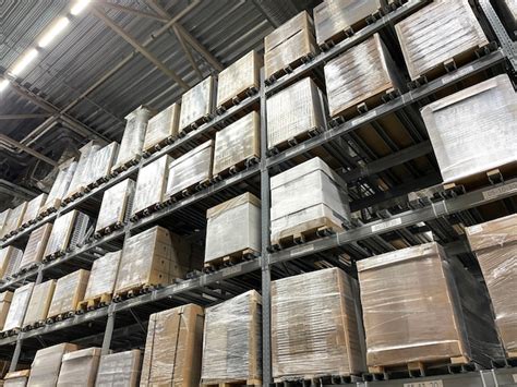 Premium Photo | A production warehouse storage with huge boxes packages on the shelves