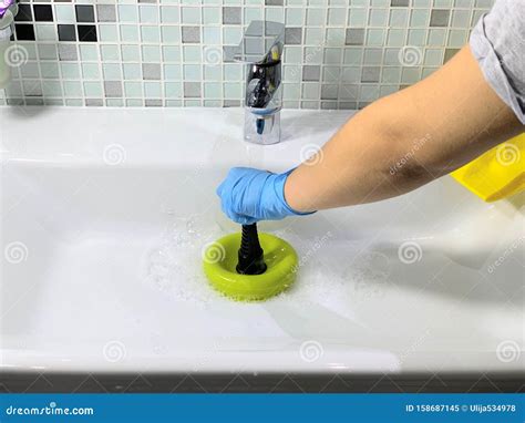 Clogged Sink.Plunger in Woman. Stock Image - Image of kitchen, clog: 158687145