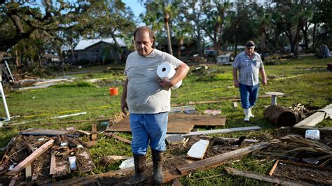 Residents pick through the rubble of lost homes and scattered belongings in Hurricane Idalia’s ...