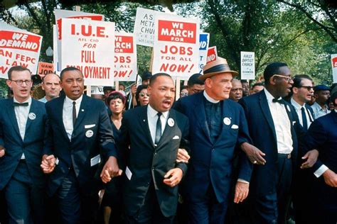 Leaders of the March on Washington for Jobs and Freedom march with signs (from R-L): Matthew ...