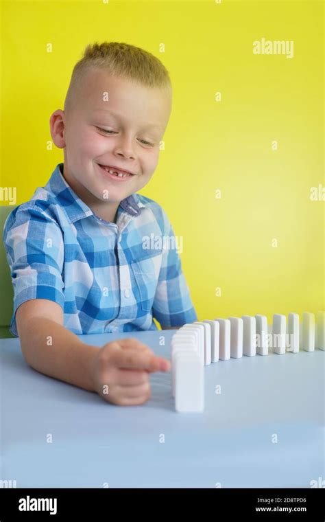 child playing board games sitting at the table Stock Photo - Alamy